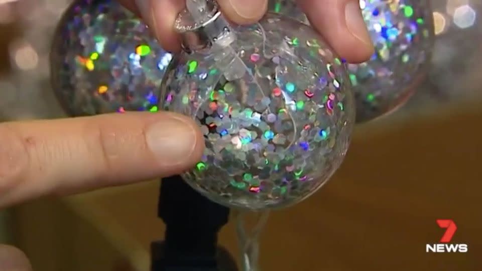 A broken bulb with exposed live electrical parts. Source: 7 News