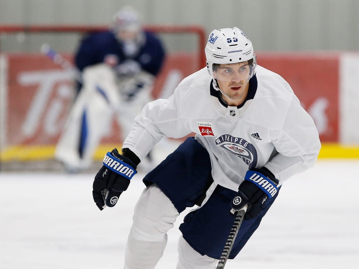 Winnipeg Jet Mark Scheifele skates during a training camp practice last month. He will miss the team's home opener after being moved into the NHL's COVID-19 protocols. (John Woods/The Canadian Press - image credit)