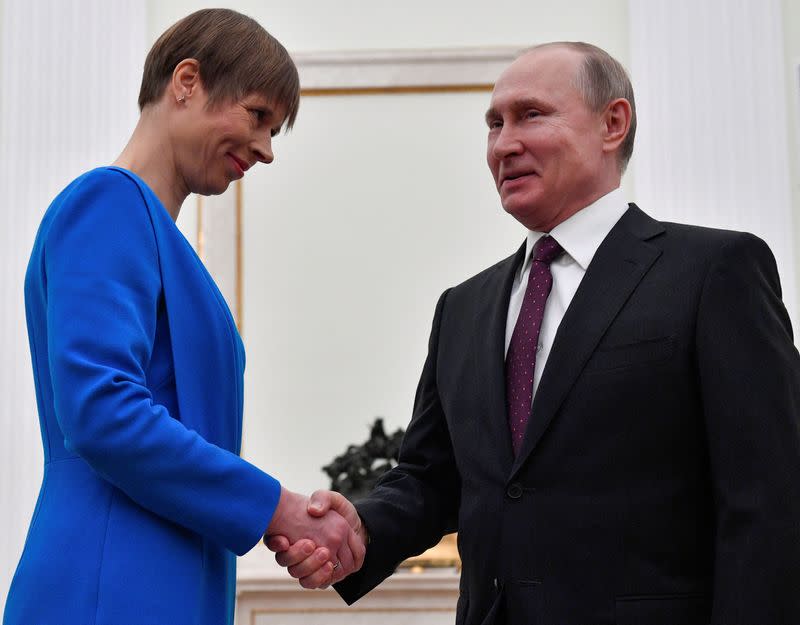 FILE PHOTO: Russian President Vladimir Putin meets with his Estonian counterpart Kersti Kaljulaid at the Kremlin in Moscow