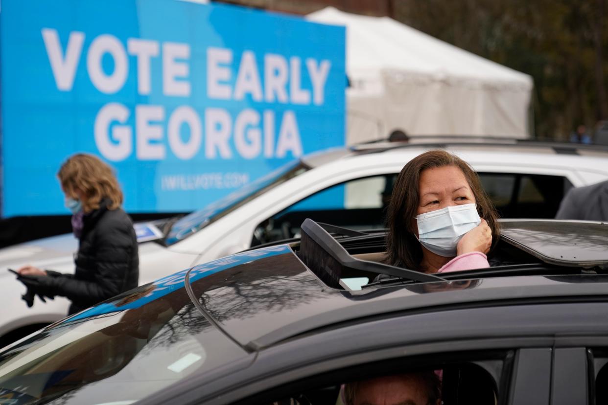<p>Attendees wait for President-elect Joe Biden to be introduced at a drive-in rally for Georgia Democratic candidates for US Senate Raphael Warnock and Jon Ossoff</p> (Copyright 2020 The Associated Press. All rights reserved.)