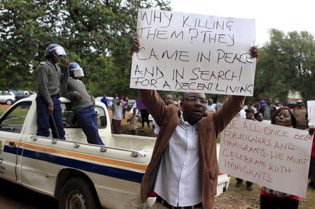 Zimbabweans hold a demonstration against the t violence outside the South African Embassy in Harare, April 17, 2015. REUTERS/Philimon Bulawayo