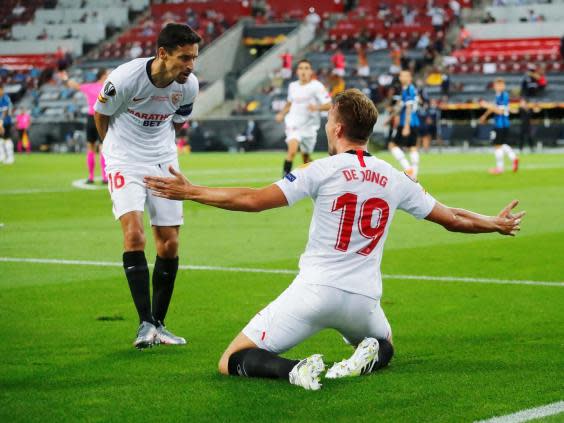 Jesus Navas celebrates with Luuk de Jong, who netted twice in the final (Reuters)