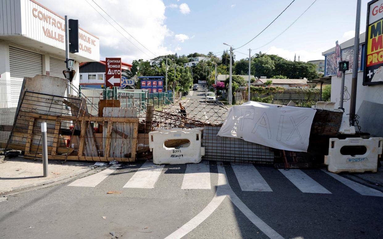 Protesters have set up road blocks around the island