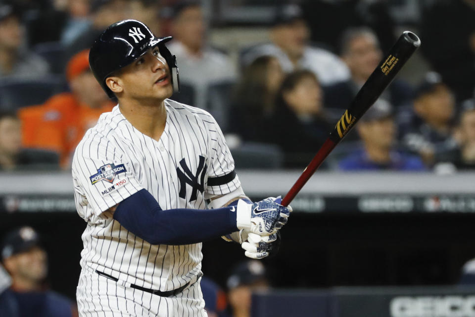 New York Yankees' Gleyber Torres watches his home run against the Houston Astros during the eighth inning in Game 3 of baseball's American League Championship Series Tuesday, Oct. 15, 2019, in New York. (AP Photo/Matt Slocum)