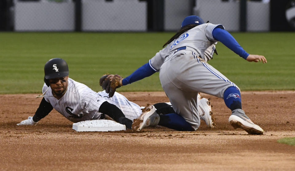 Chicago White Sox's Leury Garcia, left, steals second base as Toronto Blue Jays shortstop Freddy Galvis (16) tries to make the tag during the first inning of a baseball game Thursday, May 16, 2019, in Chicago. (AP Photo/Matt Marton)