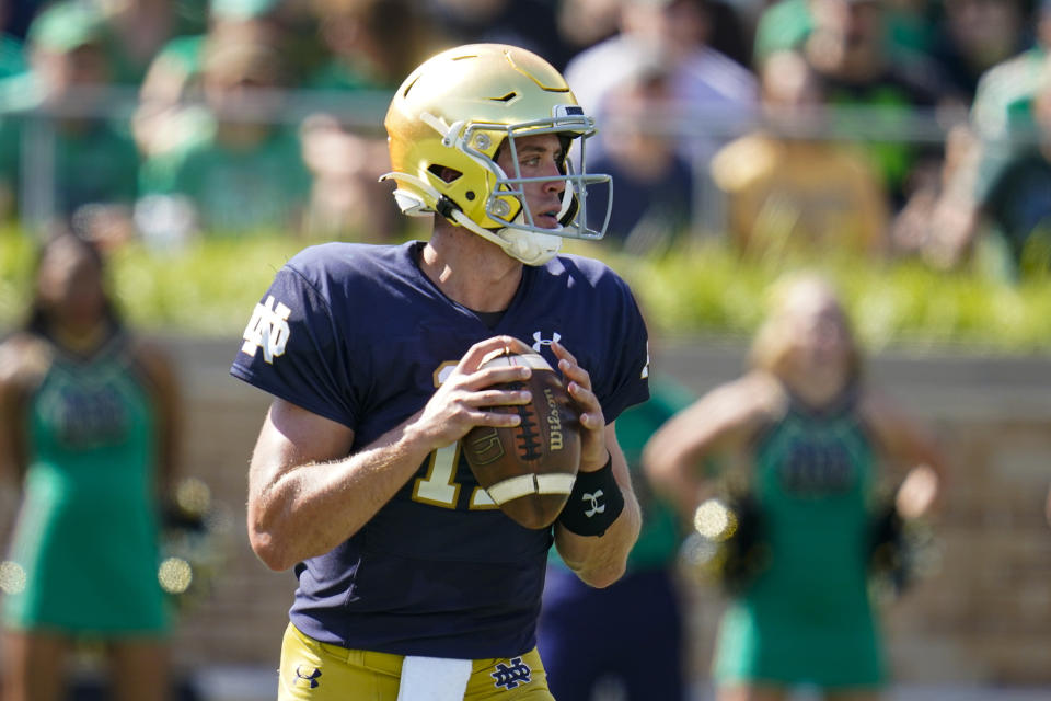 Notre Dame quarterback Jack Coan faces some familiar faces on Saturday at Soldier Field in facing his former Wisconsin program. (AP Photo/Michael Conroy)