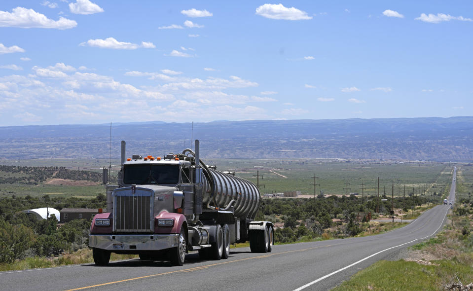 FILE - A tanker truck transports crude oil on a highway near Duchesne, Utah on July 13, 2023. The EPA on Friday, March 29, 2024, set new greenhouse gas emissions standards for heavy-duty trucks, buses and other large vehicles, an action that officials said will clean up some of the nation's largest sources of planet-warming pollution. (AP Photo/Rick Bowmer, File)