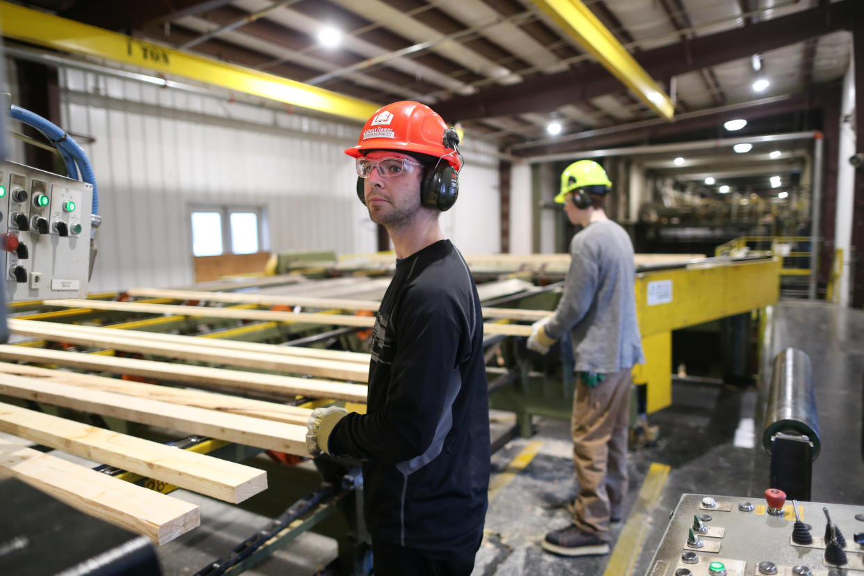 Workers inspect lumber at West Fraser Pacific Inland Resources sawmill in Smithers, British Columbia, Canada February 4, 2020. REUTERS/Jesse Winter