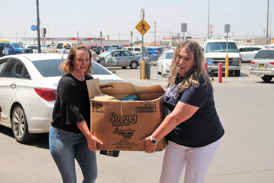 Thrive Executive Director Stephanie Hale helps load a box of school supply donations at Thrive Stuff the Bus event in August 5, 2021.

Thrive in Southern New Mexico held its annual Stuff the Bus school suppy drive August 6-7, 2021.