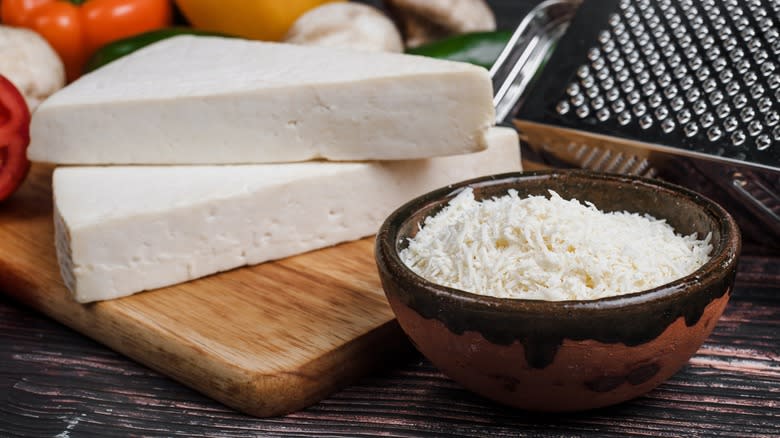 Wedges and a bowl of shredded Cotija cheese