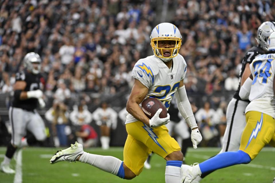 Chargers cornerback Bryce Callahan (23) returns an interception for a touchdown against the Raiders.