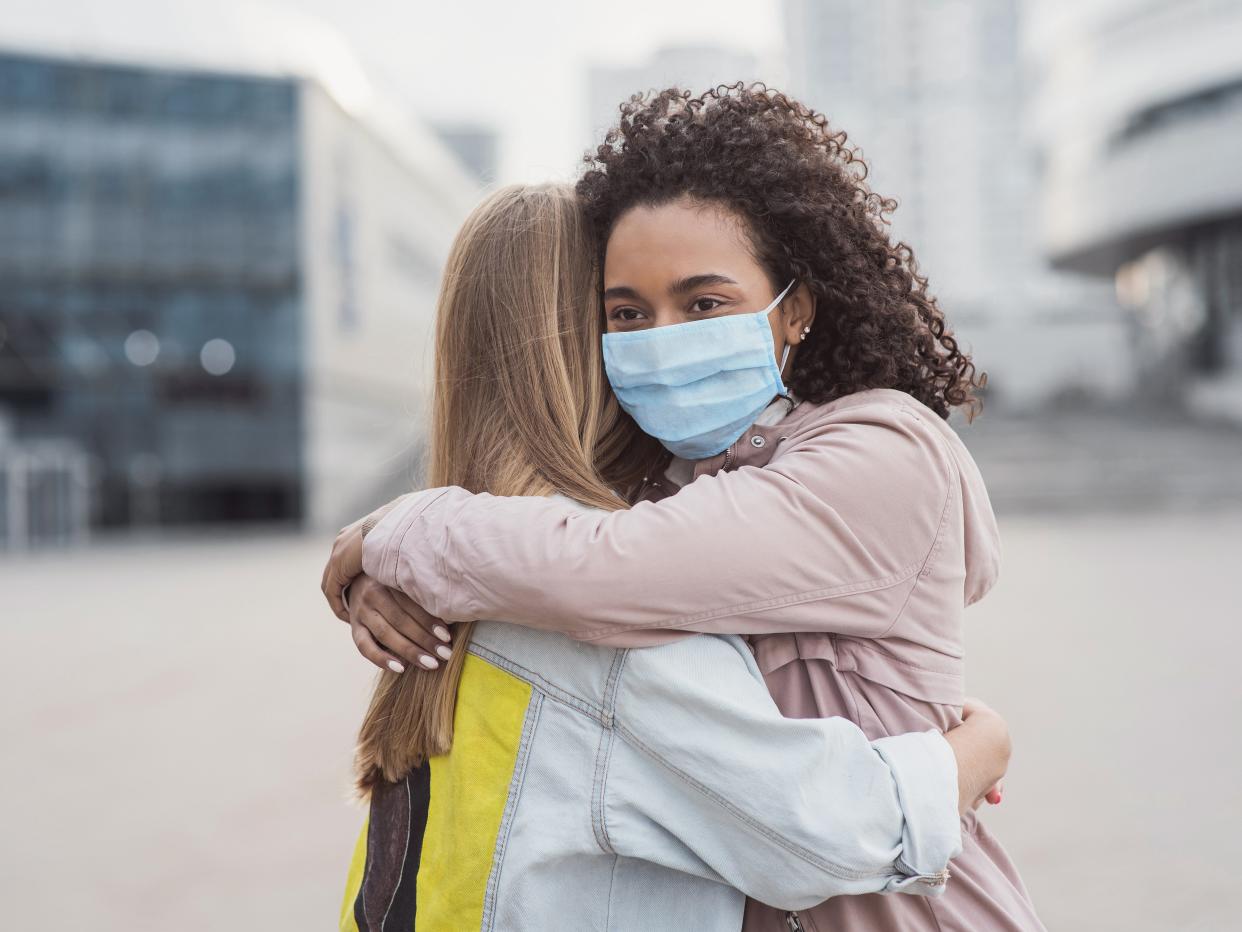 Two people embrace each other during the pandemic (Getty Images/iStockphoto)