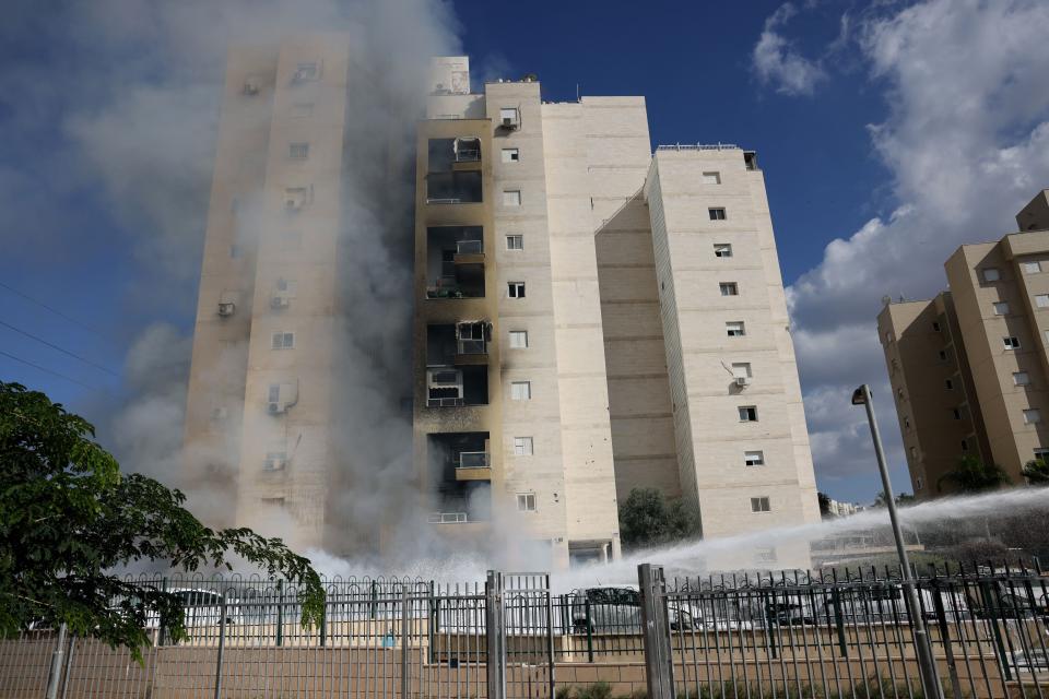 Apartments in a residential building catch fire during a rocket attack from the Gaza Strip in the southern Israeli city of Ashkelon, on Oct. 7. Palestinian militant group Hamas announced that it had launched a war against Israel.