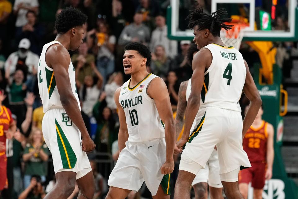 Feb 3, 2024; Waco, Texas, USA; Baylor Bears guard RayJ Dennis (10) celebrates with teammates after scoring a 3-point basket against the Iowa State Cyclones during the second half at Paul and Alejandra Foster Pavilion. Mandatory Credit: Chris Jones-USA TODAY Sports