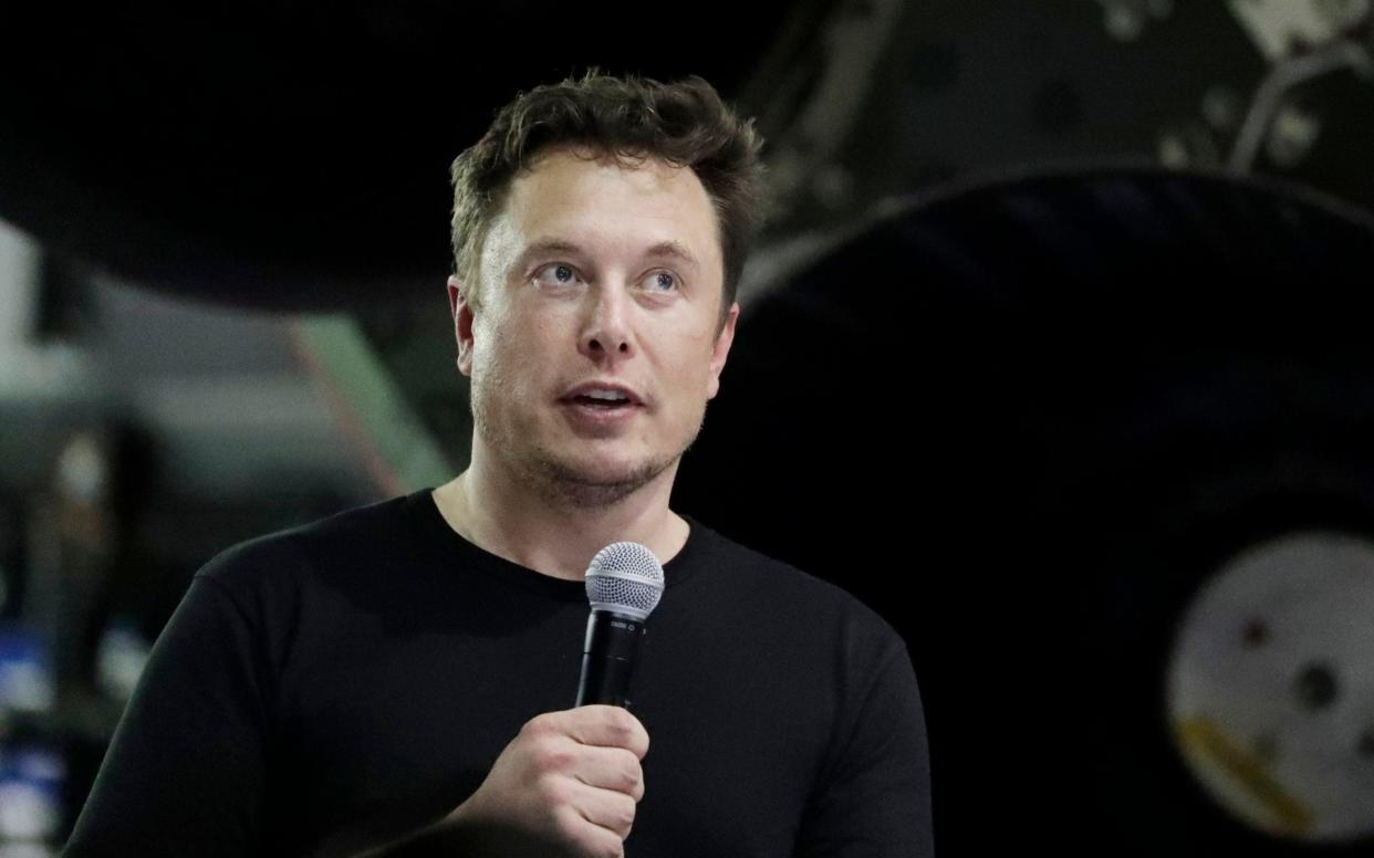 Tesla chief executive Elon Musk. The company has turned its largest profit since going public - AP