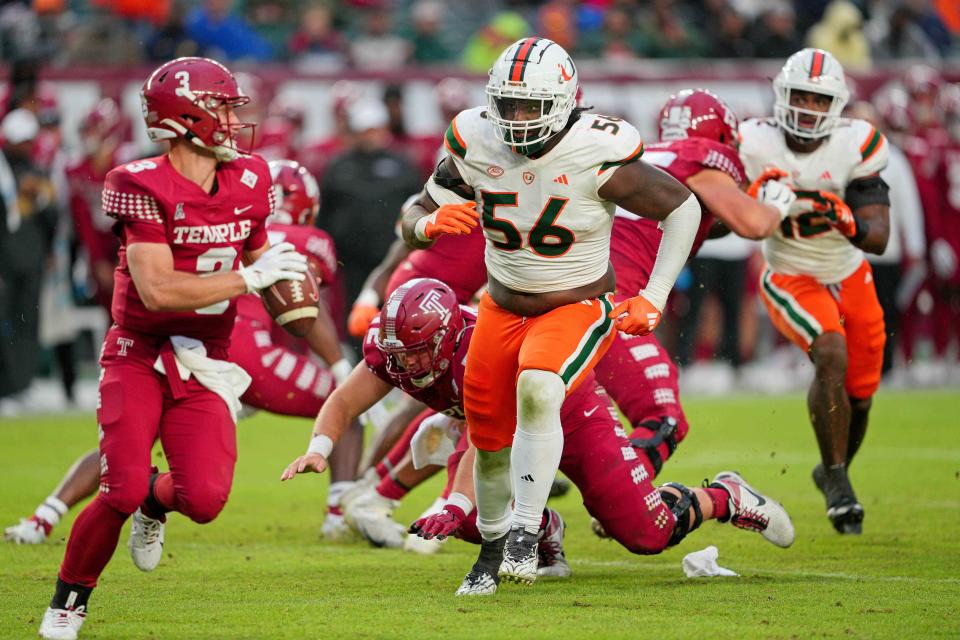 Sep 23, 2023; Philadelphia, Pennsylvania, USA; Miami Hurricanes defensive lineman Leonard Taylor III (56) pursues Temple Owls quarterback E.J. Warner (3) in the second half against the Temple Owls at Lincoln Financial Field. Mandatory Credit: Andy Lewis-USA TODAY Sports