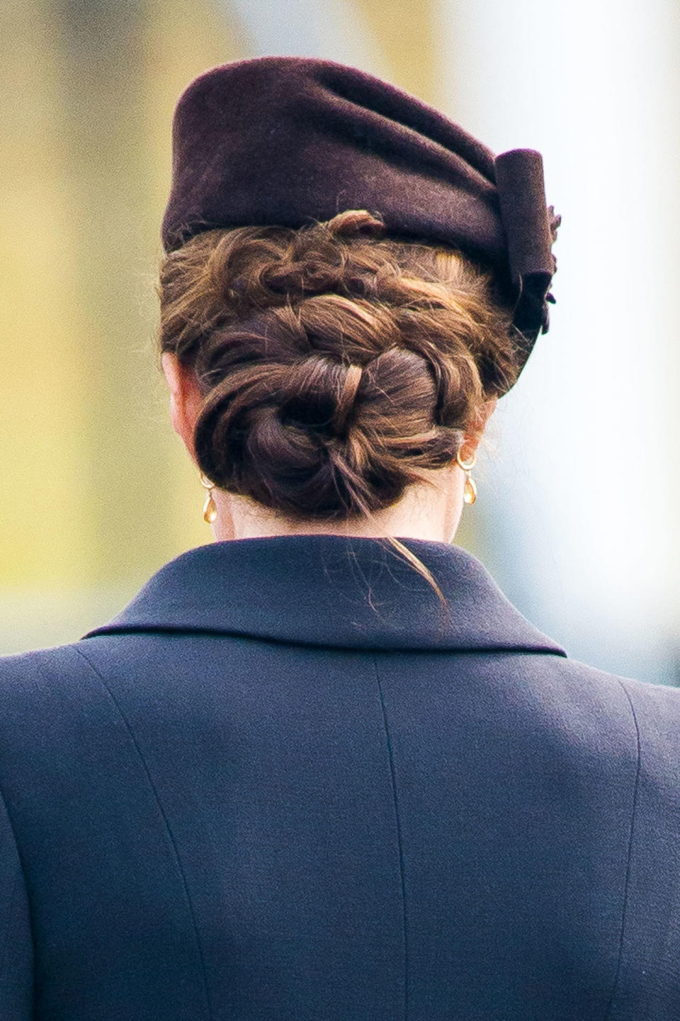 <p>Twisted and knotted into a perfect, low bun. </p>