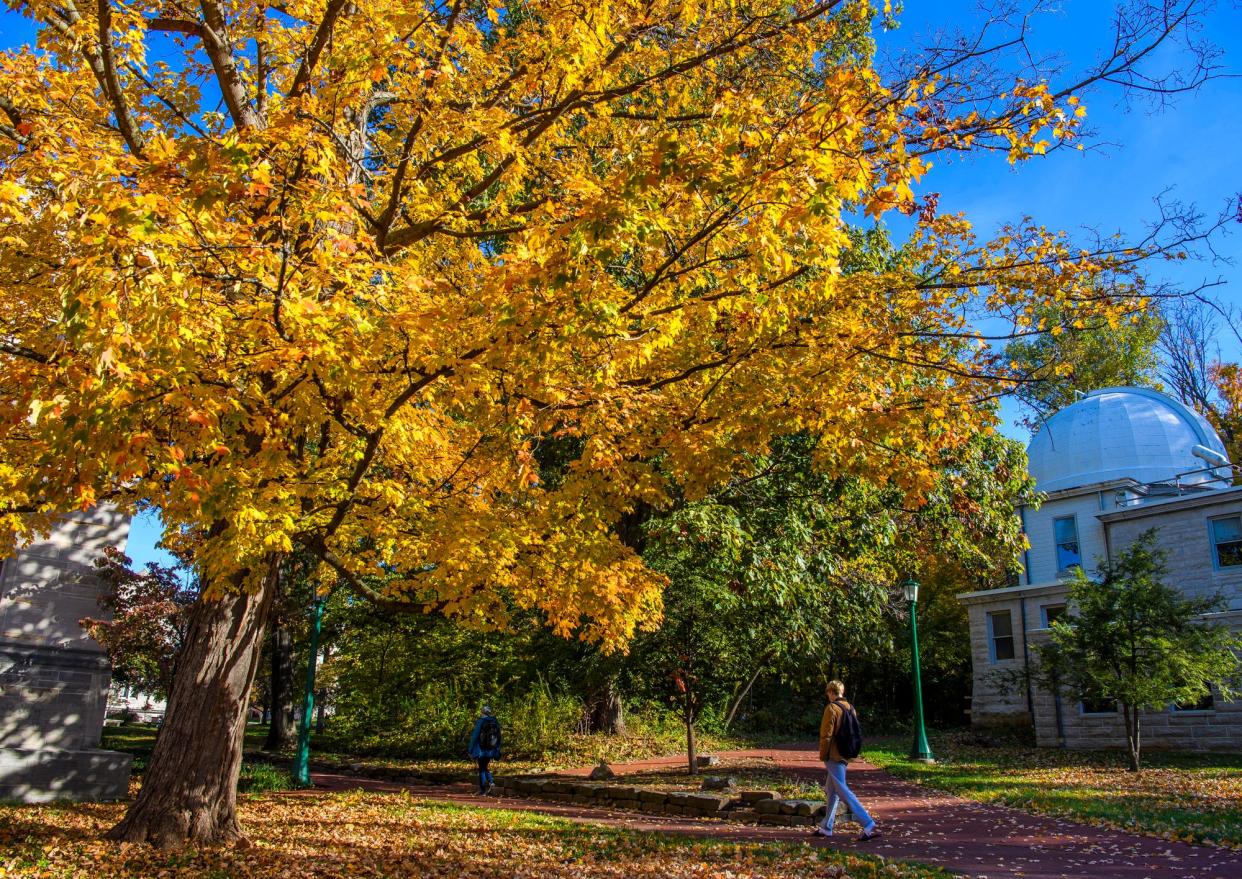 A student with a backpack heads by the Kirkwood Observatory Nov. 3 on the Indiana University campus.