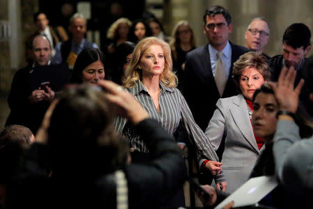 FILE PHOTO: Summer Zervos, a former contestant on The Apprentice, leaves New York State Supreme Court with attorney Gloria Allred, after a hearing on the defamation case against U.S. President Donald Trump in Manhattan, New York City, U.S., December 5, 2017. REUTERS/Andrew Kelly/File Photo