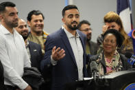 Abdul Wasi Safi, center, speaks as his brother, Sami-ullah Safi, left, and U.S. Rep. Sheila Jackson Lee, D-Texas, right, listen during a news conference Friday, Jan. 27, 2023, in Houston. Wasi Safi, an intelligence officer for the Afghan National Security Forces who fled Afghanistan following the withdrawal of U.S. forces, was freed this week and reunited with his brother after spending months in immigration detention. (AP Photo/David J. Phillip)