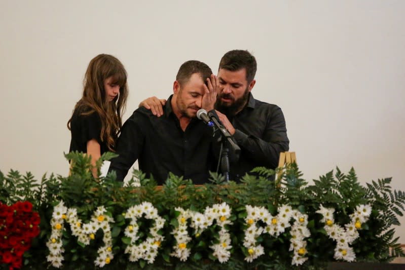 Tyler Johnson, husband of Christina Marie Langford Johnson, who was killed by unknown assailants, reacts during her funeral service, before a burial at the cemetery in LeBaron, Chihuahua