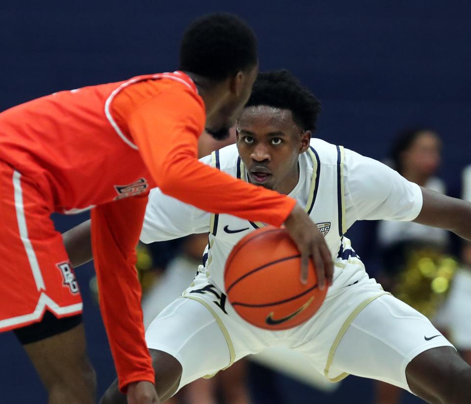 Akron's Ali Ali stares down Bowling Green's Trey Thomas on Jan. 5 in Akron.