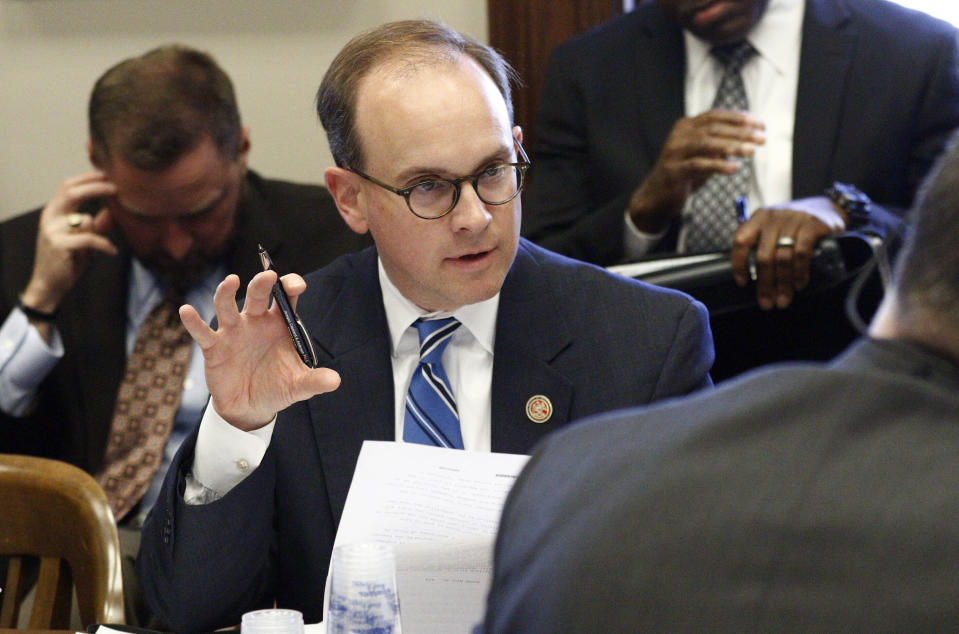 FILE - In this Feb. 17, 2016 file photo, then Rep. Cory Wilson, R-Madison, discusses a transportation issue during a House Transportation Committee meeting at the Capitol in Jackson, Miss. The Senate Judiciary Committee has advanced a federal appeals court nominee from Mississippi, despite Democratic objections over derisive comments he made about former President Barack Obama and his signature health care legislation. The GOP-led panel endorsed Mississippi Appeals Court Judge Cory Wilson Thursday on a 12-10, party line vote. The nomination now goes to the full Senate. (AP Photo/Rogelio V. Solis, File)