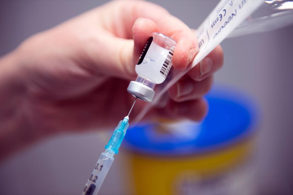 Immunisation Nurse Debbie Briody prepares the Pfizer/BioNtech Covid-19 vaccine prior to administration, at the NHS Louisa Jordan temporary hospital at the SEC Campus in Glasgow, Scotland on January 23, 2021. (Photo by Andy Buchanan / AFP) (Photo by ANDY BUCHANAN/AFP via Getty Images)