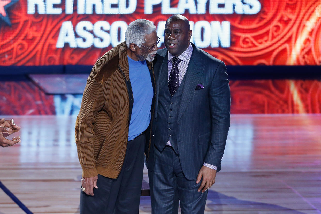 NEW ORLEANS, LA - FEBRUARY 19:  Former NBA players Bill Russell (L) and Earvin 