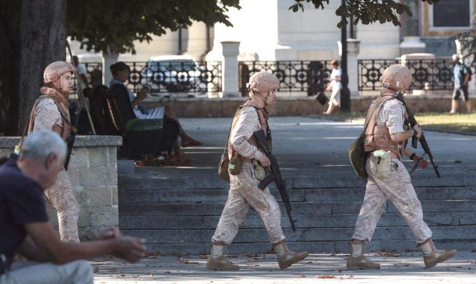 Russian Navy personnel patrol in front of the headquarters of Russia's Black Sea Fleet, in Sevastopol, Crimea, in a July 31, 2022 file photo. / Credit: STRINGER/AFP/Getty