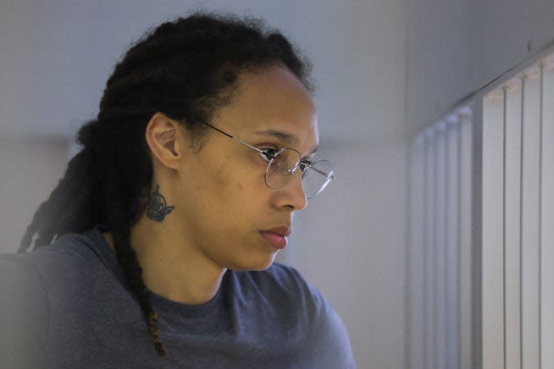 Brittney Griner, who was detained at Moscow’s Sheremetyevo airport and later charged with illegal possession of cannabis, waits for the verdict inside a defendants’ cage during a hearing in Khimki outside Moscow, on August 4, 2022. (Photo by EVGENIA NOVOZHENINA / POOL / AFP) (Photo by EVGENIA NOVOZHENINA/POOL/AFP via Getty Images)