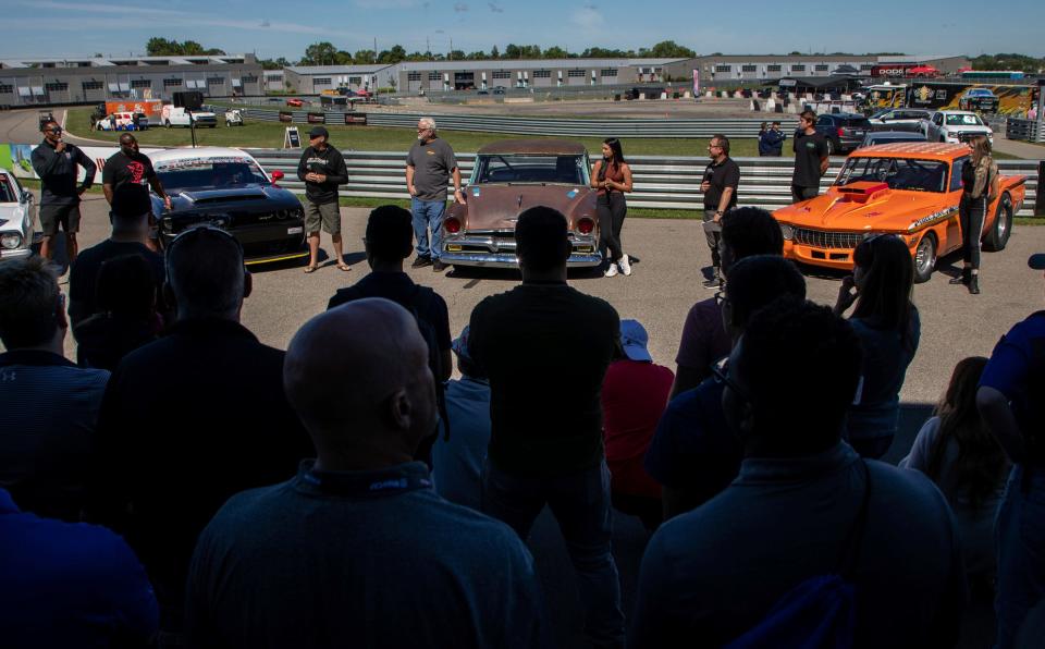 Members of the media, drivers and race car fans gather for the Roadkill Nights 2022 preview event at the M1 Concourse in Pontiac on Aug. 12, 2022.