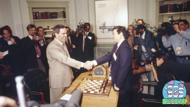Kasparov (left) shakes hands with IBM’s Feng-hsiung Hsu, Deep Blue’s principal designer.