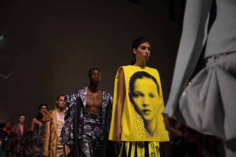 A model, wearing an outfit which has on it the image of model Kate Moss, walks the runway at the Fashion For Relief charity event in central London, Saturday, Sept. 14, 2019.