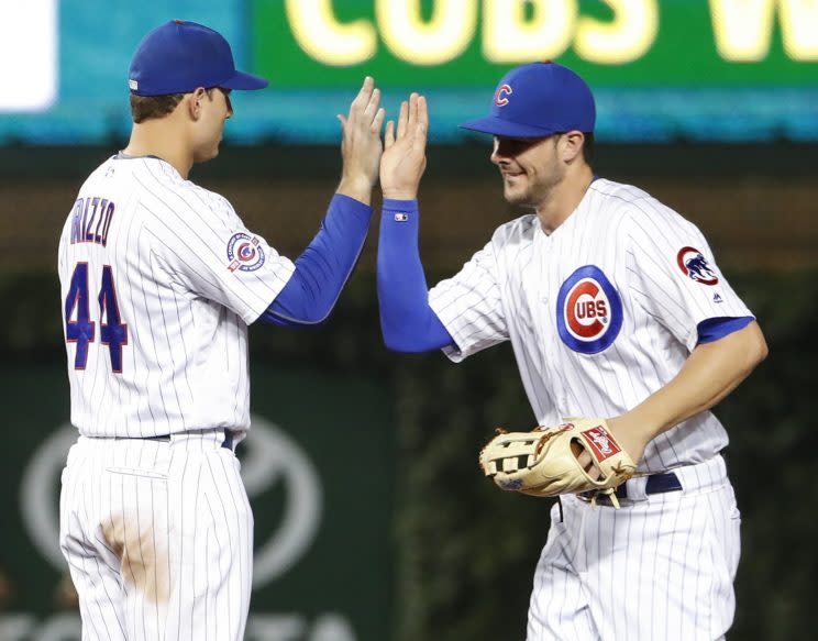 Kris Bryant and Anthony Rizzo have plenty to high five about. (AP)