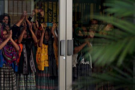 Indigenous women of the Mayan ethnic Q'eqchi group acknowledge their supporters after a verdict was given in the Sepur Zarco case in Guatemala City, Guatemala, February 26, 2016. A judge sentenced Guatemalan Army Colonel Esteelmer Reyes Giron to 120 years and ex-military commissioner Heriberto Valdez to 240 years in prison for committing crimes against humanity, as well as sexual violence and slavery against fifteen indigenous women of the Mayan ethnic Q'eqchi group, between 1982 to 1986 at the military base of Sepur Zarco, during Guatemala's bloody 36-year civil war, local media reported. REUTERS/Josue Decavele - RTS87LV