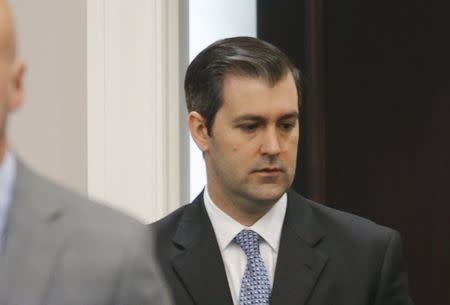 Former North Charleston police officer Michael Slager, 34, standing trial on a murder charge in the April 2015 shooting death of 50-year-old Walter Scott, walks into the courtroom in Charleston, South Carolina, U.S., November 3, 2016. REUTERS/Grace Beahm/Pool