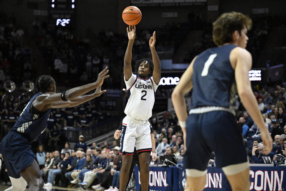 UConn guard Tristen Newton (2) shoots against New Hampshire in the second half of an NCAA college basketball game, Monday, Nov. 27, 2023, in Storrs, Conn. (AP Photo/Jessica Hill)