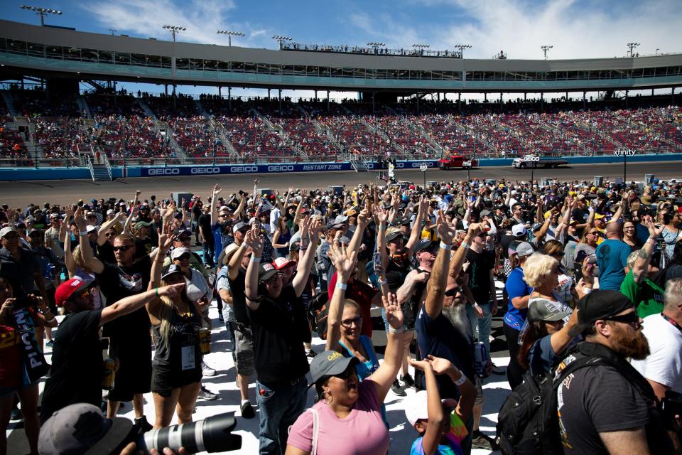 Fans cheer as their favorite driver gets introduced before the Ruoff Mortgage 500 on March 13, 2022, at Phoenix Raceway in Avondale, AZ.