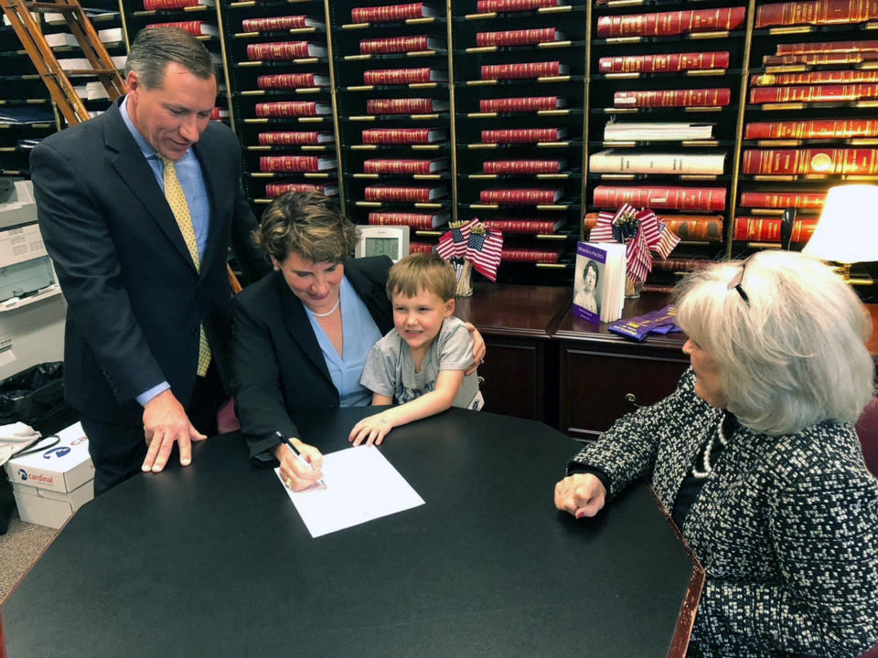 Amy McGrath officially files papers to challenge Senate Majority Leader Mitch McConnell, Friday, Dec. 27, 2019 in Frankfurt, Ky. Calling her party's victory in the Kentucky governor's race a jolt of momentum for her own bid to unseat a Republican incumbent, Democrat Amy McGrath on Friday officially filed to challenge Senate Majority Leader Mitch McConnell in what looms as a bruising, big-spending campaign next year. (AP Photo/Bruce Schreiner)