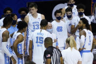North Carolina coach Roy Williams talks with his team near the end of an NCAA college basketball game for the championship of the Maui Invitational, Wednesday, Dec. 2, 2020, in Asheville, N.C. Texas won 69-67. (AP Photo/Kathy Kmonicek)