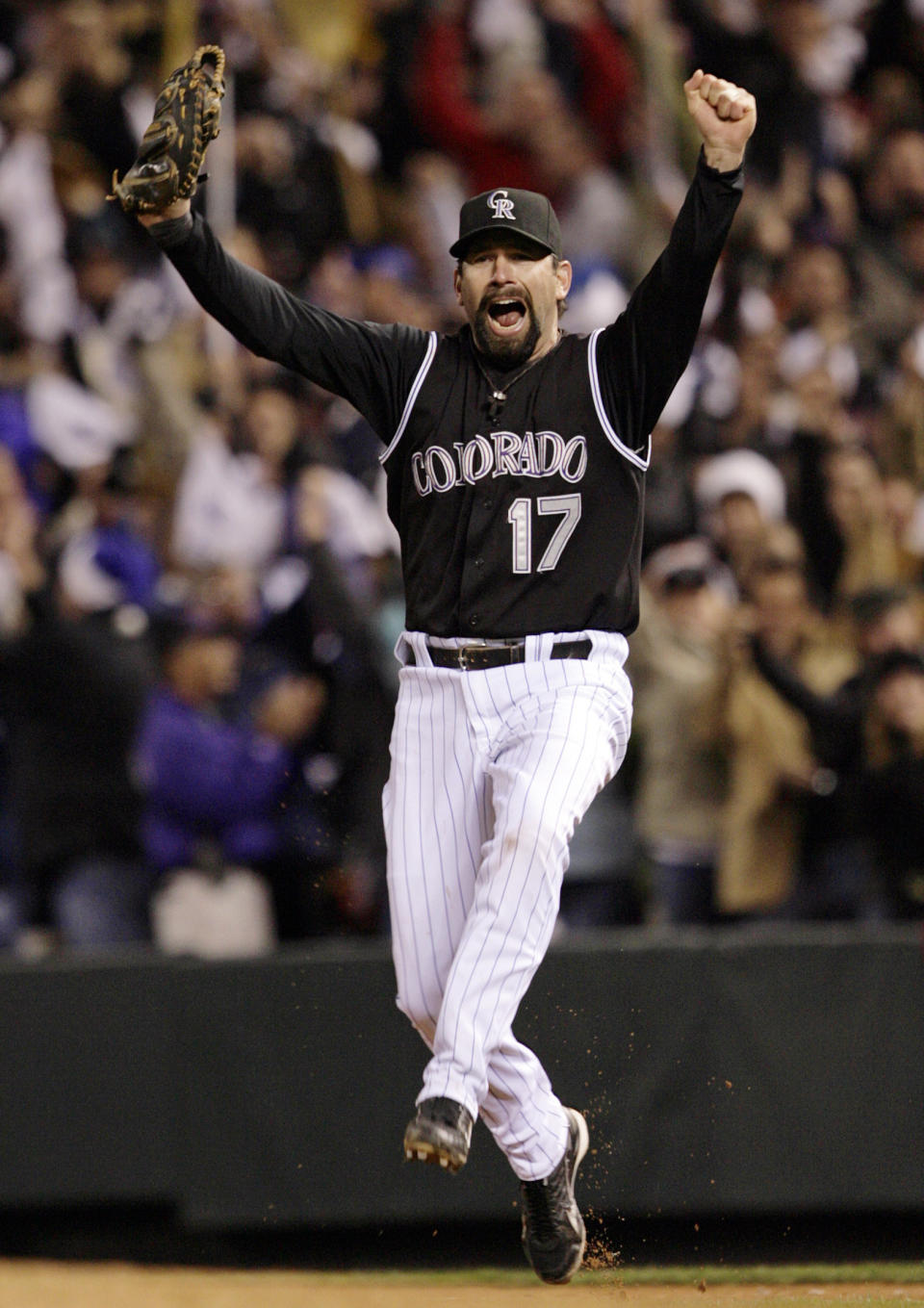 FILE - Colorado Rockies first baseman Todd Helton (17) celebrates after he made the last out to win Game 4 of the National League Championship baseball series against the Arizona Diamondbacks, 6-4, and advance to the World Series, Monday, Oct. 15, 2007, in Denver. Helton, Billy Wagner and Scott Rolen are leading contenders to be elected to baseball's Hall of Fame in the Baseball Writers' Association of America vote announced Tuesday, Jan. 24, 2023.(AP Photo/David Zalubowski, File)