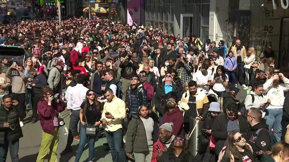 <div>Hundreds of people gathered in Times Square in Manhattan to witness the total solar eclipse.</div>