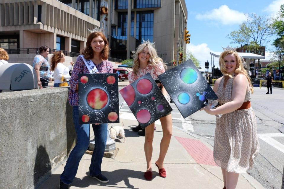 Visitors show off their Spray Paint Art creations at a We HeART Fall River event during the 2022 festival. The 2024 festival is scheduled for May 11.