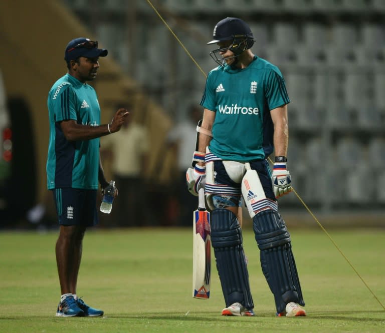 England's David Willey (R) gets batting tips from former Sri Lanka captain Mahela Jayawardene, who acted as a batting consultant to England at the World Twenty20 in India