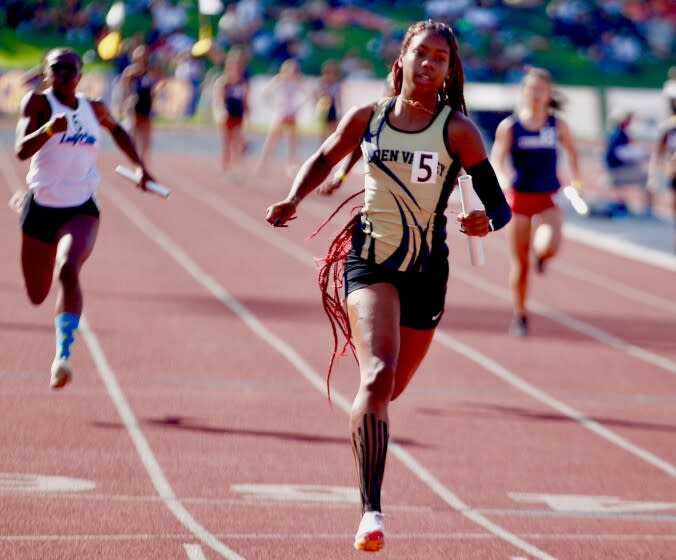Golden Valley anchor runner Adonijah Currie crosses the finish line in the girls' 4100 relay at state prelims in Clovis.