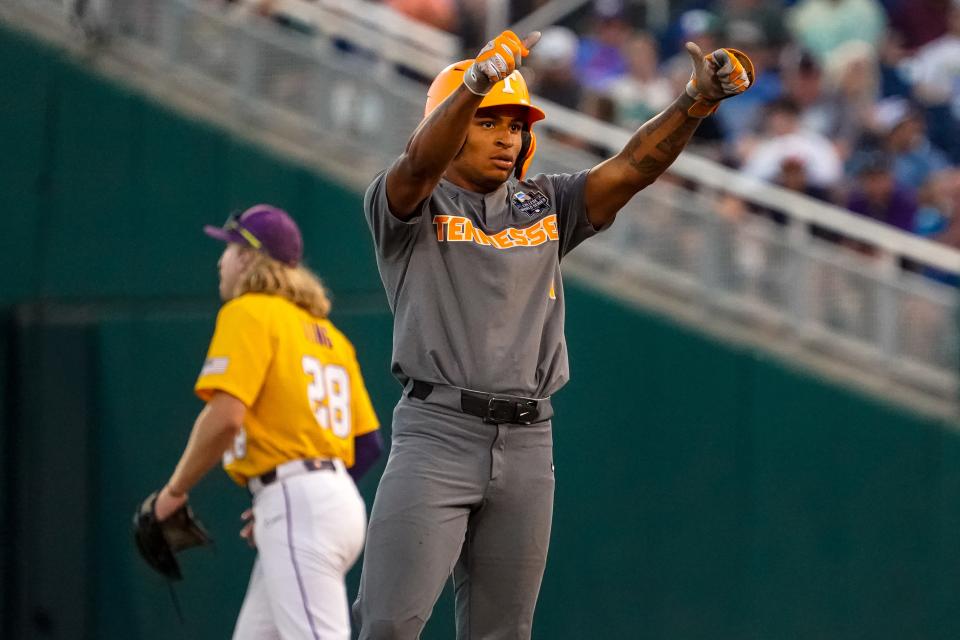 Tennessee second baseman Christian Moore (1) holds his thumbs up after hitting a double against the LSU during the 2023 College World Series at Charles Schwab Field Omaha.