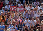 Fans in the crowd show their support for Great Britain's Andy Murray during his match against Serbia's Novak Djokovic on day thirteen of the Wimbledon Championships at The All England Lawn Tennis and Croquet Club, Wimbledon.