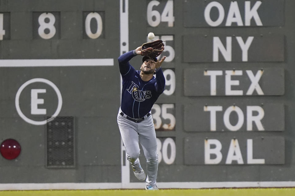 Tampa Bay Rays' David Peralta catches a fly ball hit to left field by Boston Red Sox's Triston Casas during the sixth inning of a baseball game Wednesday, Oct. 5, 2022, in Boston. (AP Photo/Steven Senne)