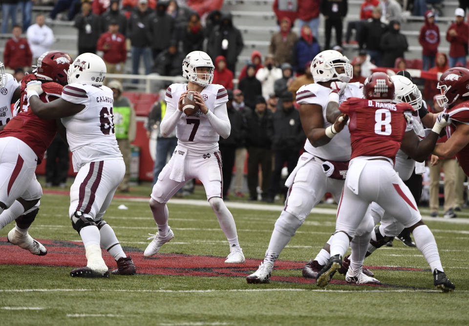 Mississippi State quarterback Nick Fitzgerald drops back top pass against Arkansas during the second half of an NCAA college football game Saturday, Nov. 18, 2017 in Fayetteville, Ark. (AP Photo/Michael Woods)